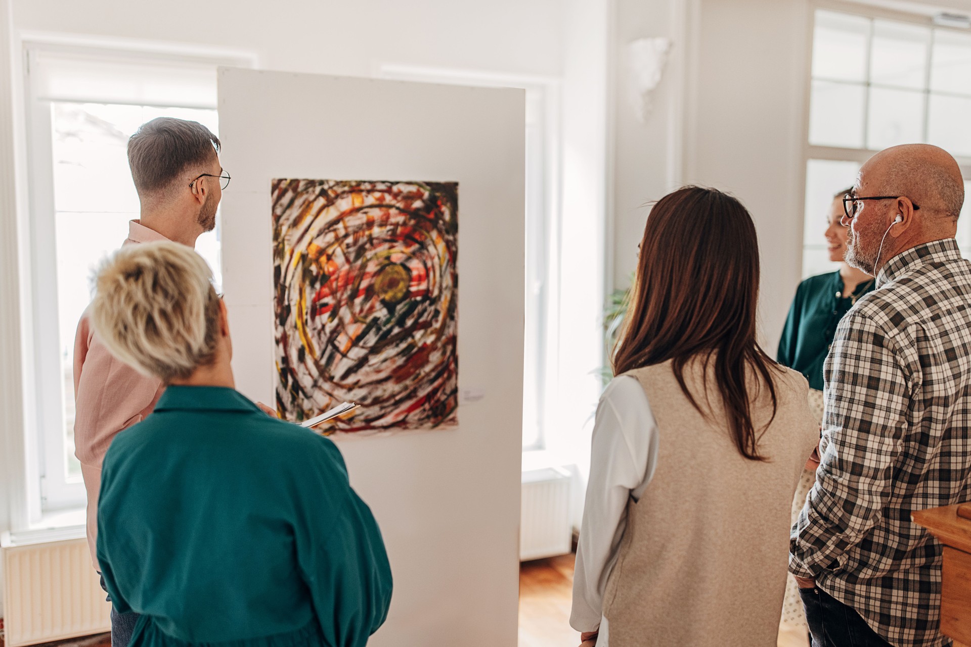 People looking at painting